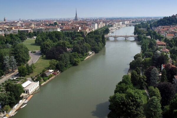Po River in Torino with the city and greenery on either side.