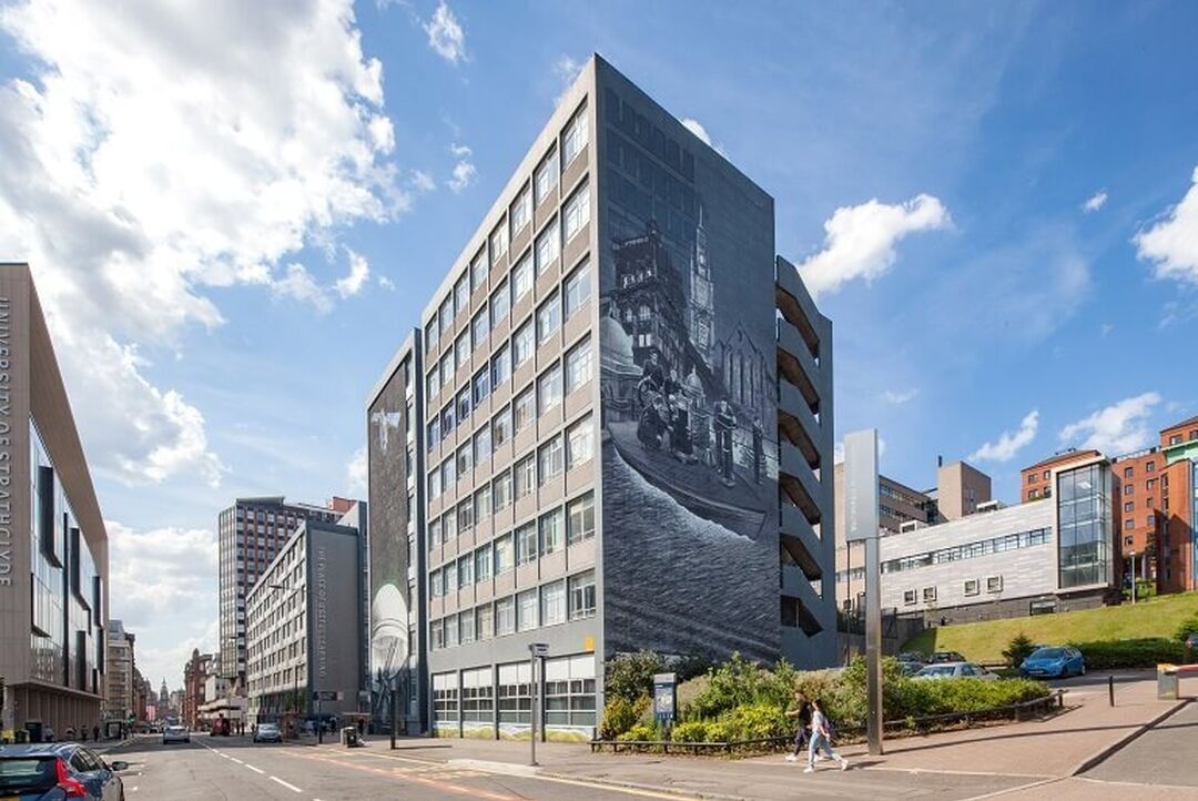 A mural on the side of a University of Strathclyde building on a main city road.