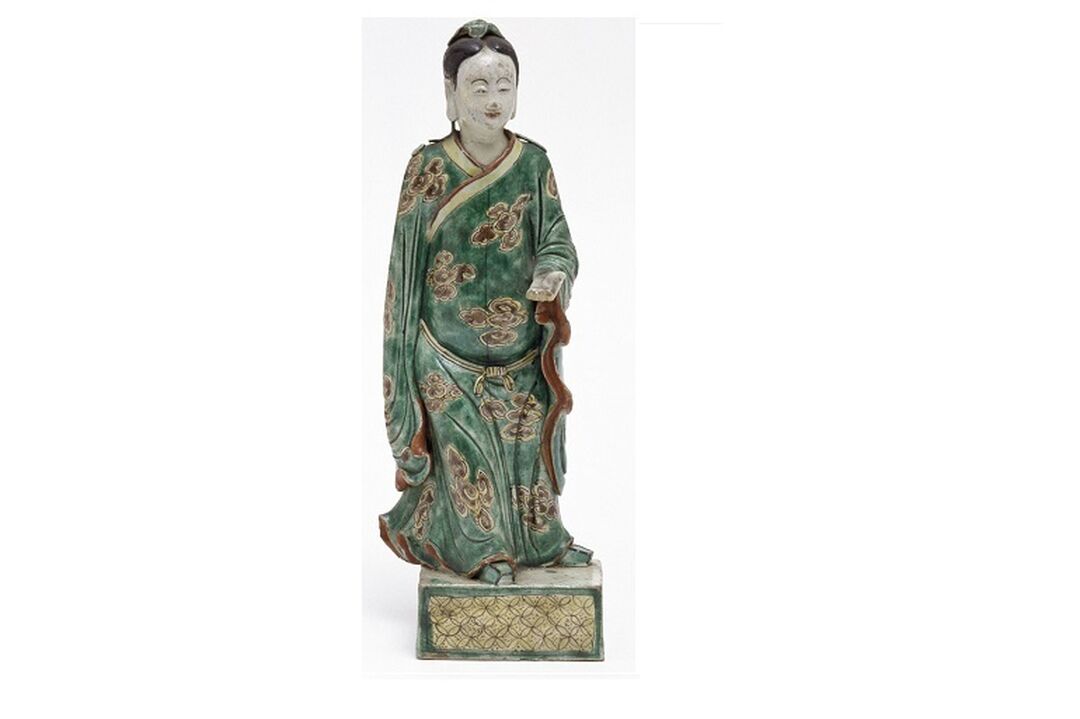 A statue of a person wearing their hair tied back and long green robes.