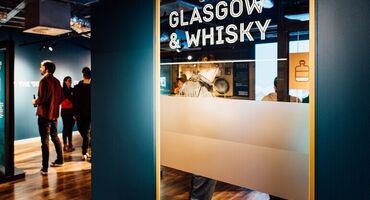 The Clydeside Distillery exhibition and tour, with a welcome sign reading 'Glasgow & whisky.'