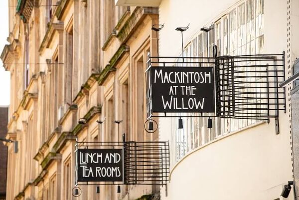 The signage to the Charles Rennie Mackintosh designed Willow Tea Rooms is in his Art Nouveau style and reads 'Mackintosh at the Willow' and 'Lunch and Tearooms'