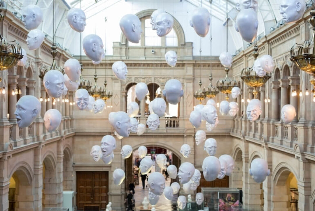 Interior of Kelvingrove Art Gallery and Museum showing the floating heads installation